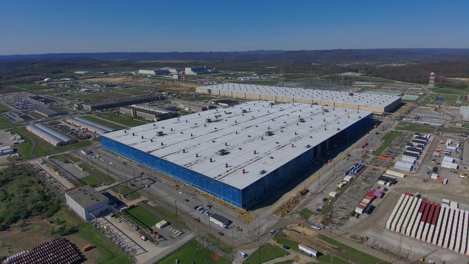 The X-333 cleanup building at the Portsmouth site near Piketon, with blue demolition netting around its exterior